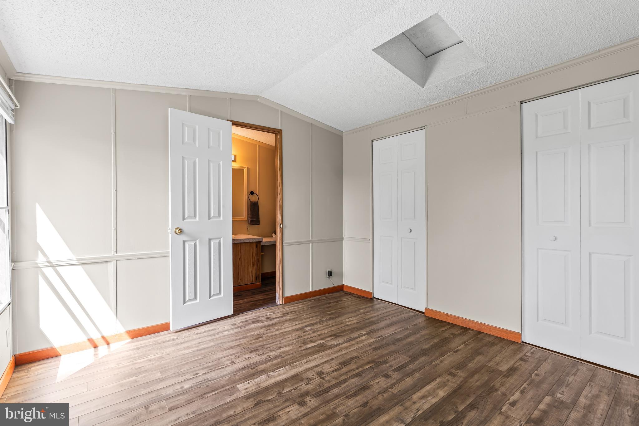 1217 Nestle Quarry Road Falling Waters, WV 25419 - Photo 27 of 52 a view of an empty room with wooden floor