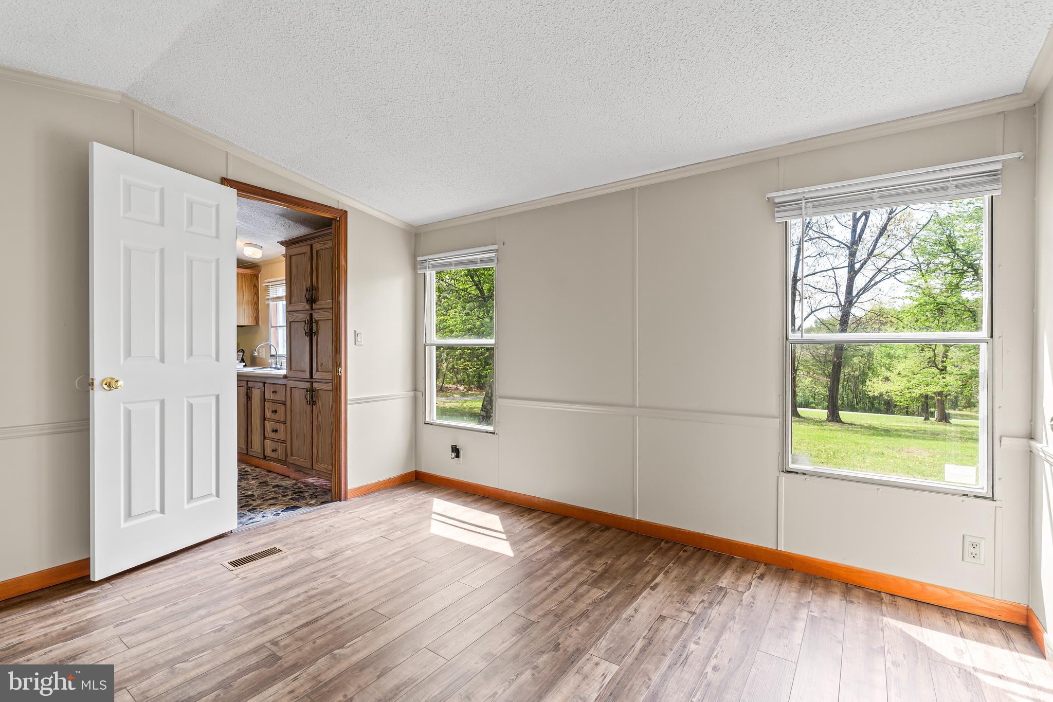 1217 Nestle Quarry Road Falling Waters, WV 25419 - Photo 28 of 52 a view of a livingroom with wooden floor and windows