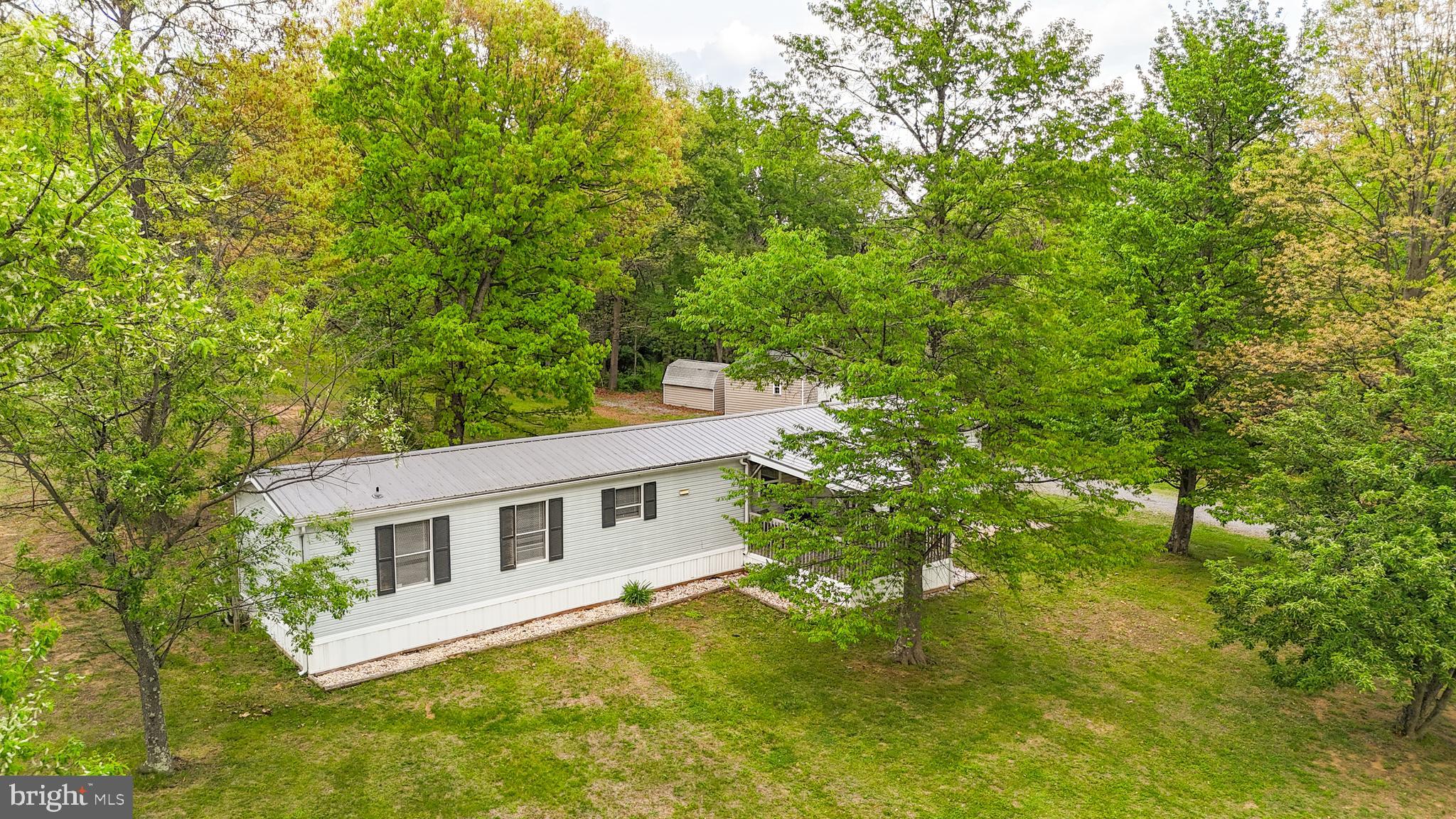 1217 Nestle Quarry Road Falling Waters, WV 25419 - Photo 49 of 52 a front view of a house with garden