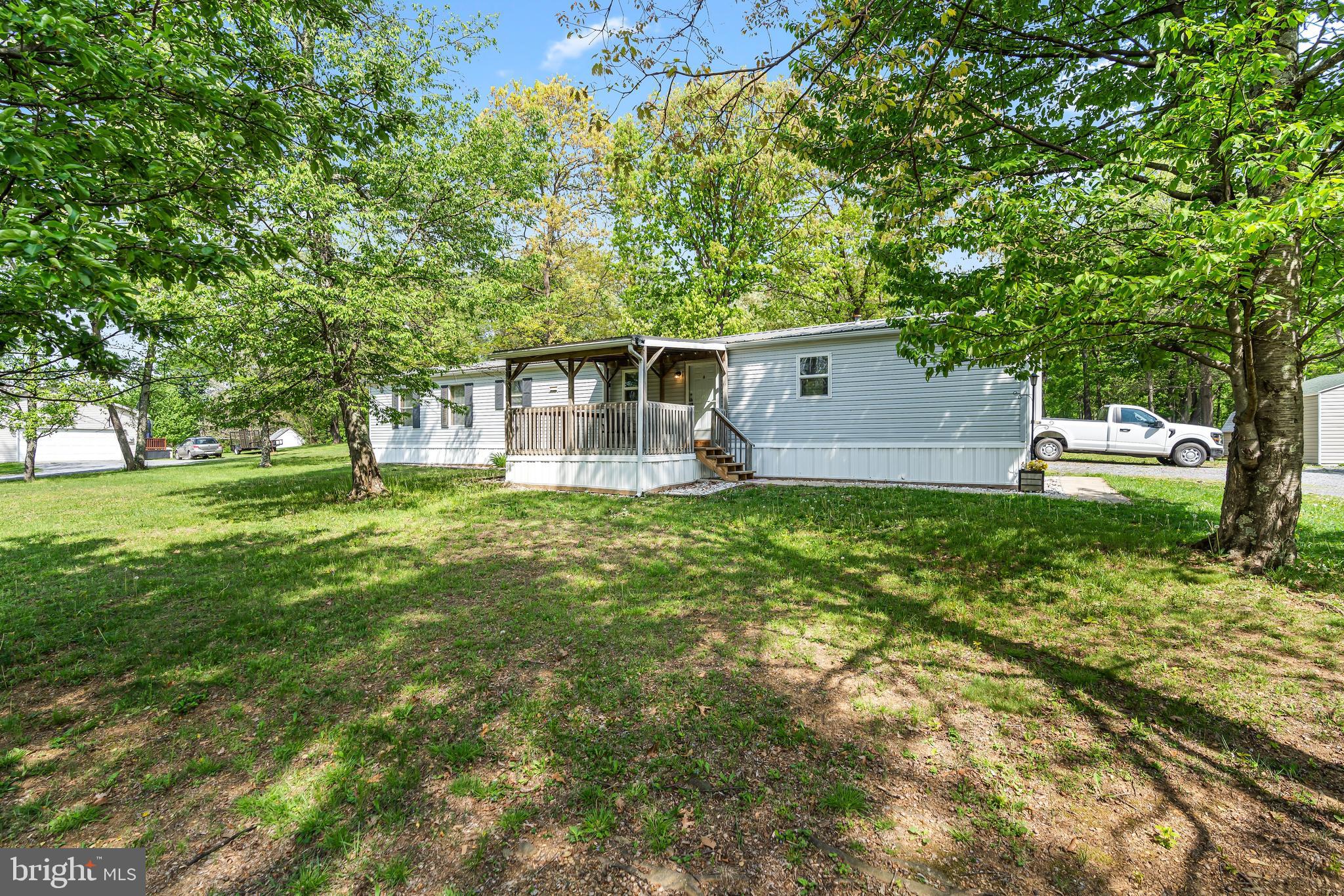 1217 Nestle Quarry Road Falling Waters, WV 25419 - Photo 6 of 52 a front view of house with yard and green space