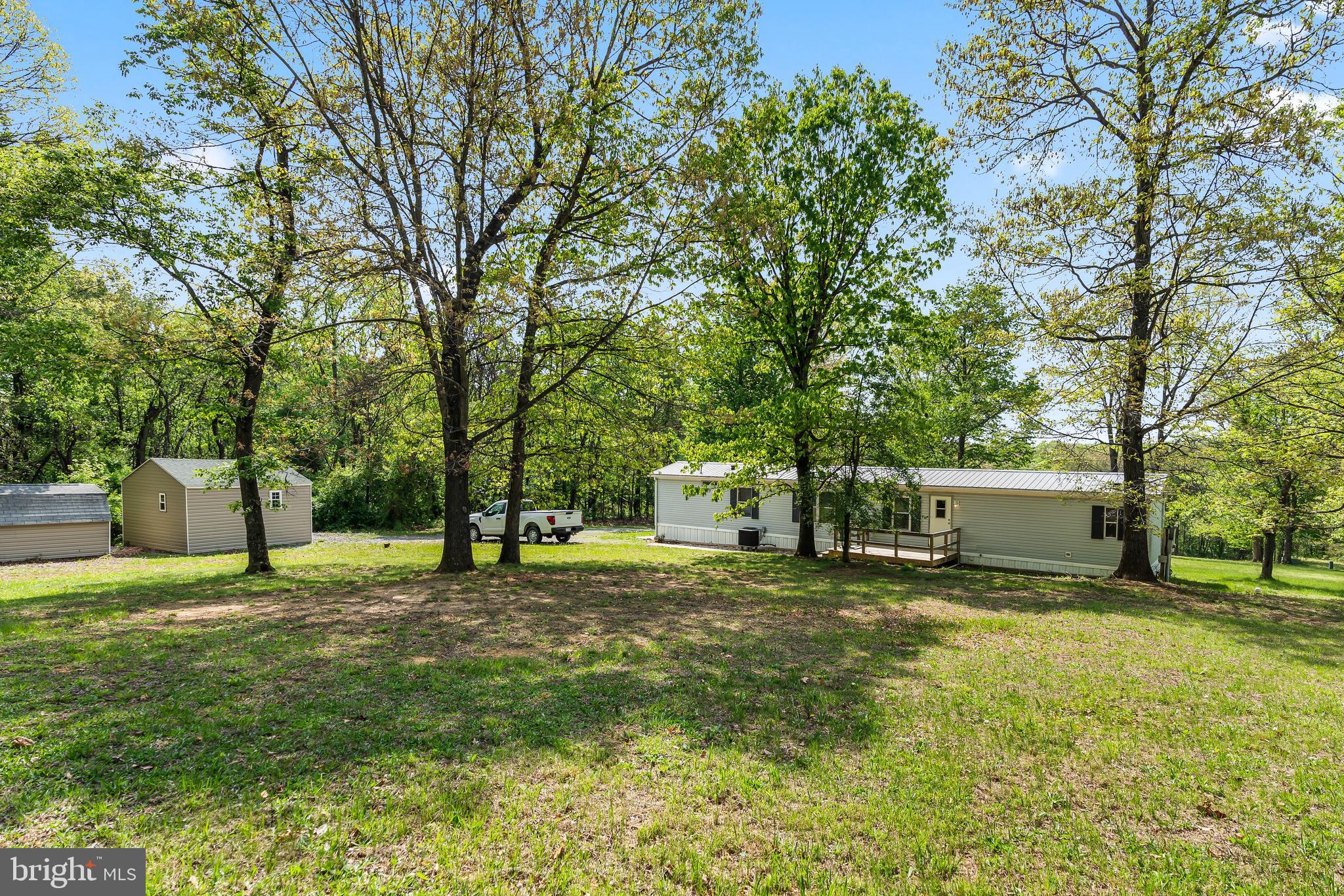 1217 Nestle Quarry Road Falling Waters, WV 25419 - Photo 10 of 52 a view of a outdoor space with a house and large trees