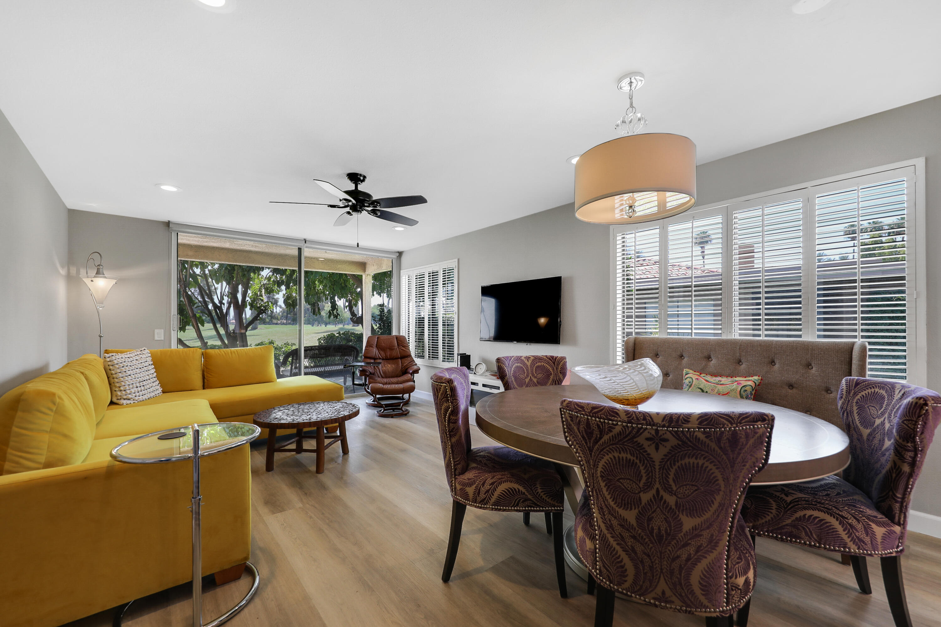 a view of a dining room with furniture window and outside view