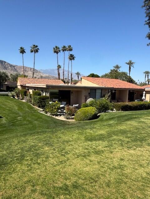 41 Sunrise Drive Rancho Mirage, CA 92270 - Photo 16 of 51 a front view of a house with garden