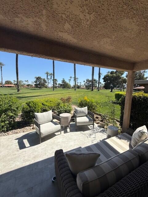 41 Sunrise Drive Rancho Mirage, CA 92270 - Photo 17 of 51 a view of a patio with couches chairs and a table