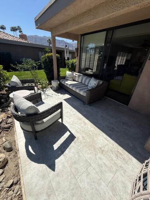 41 Sunrise Drive Rancho Mirage, CA 92270 - Photo 19 of 51 a view of swimming pool with outdoor seating and a potted plant