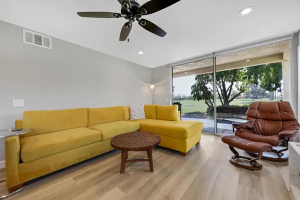 a living room with furniture and a large window