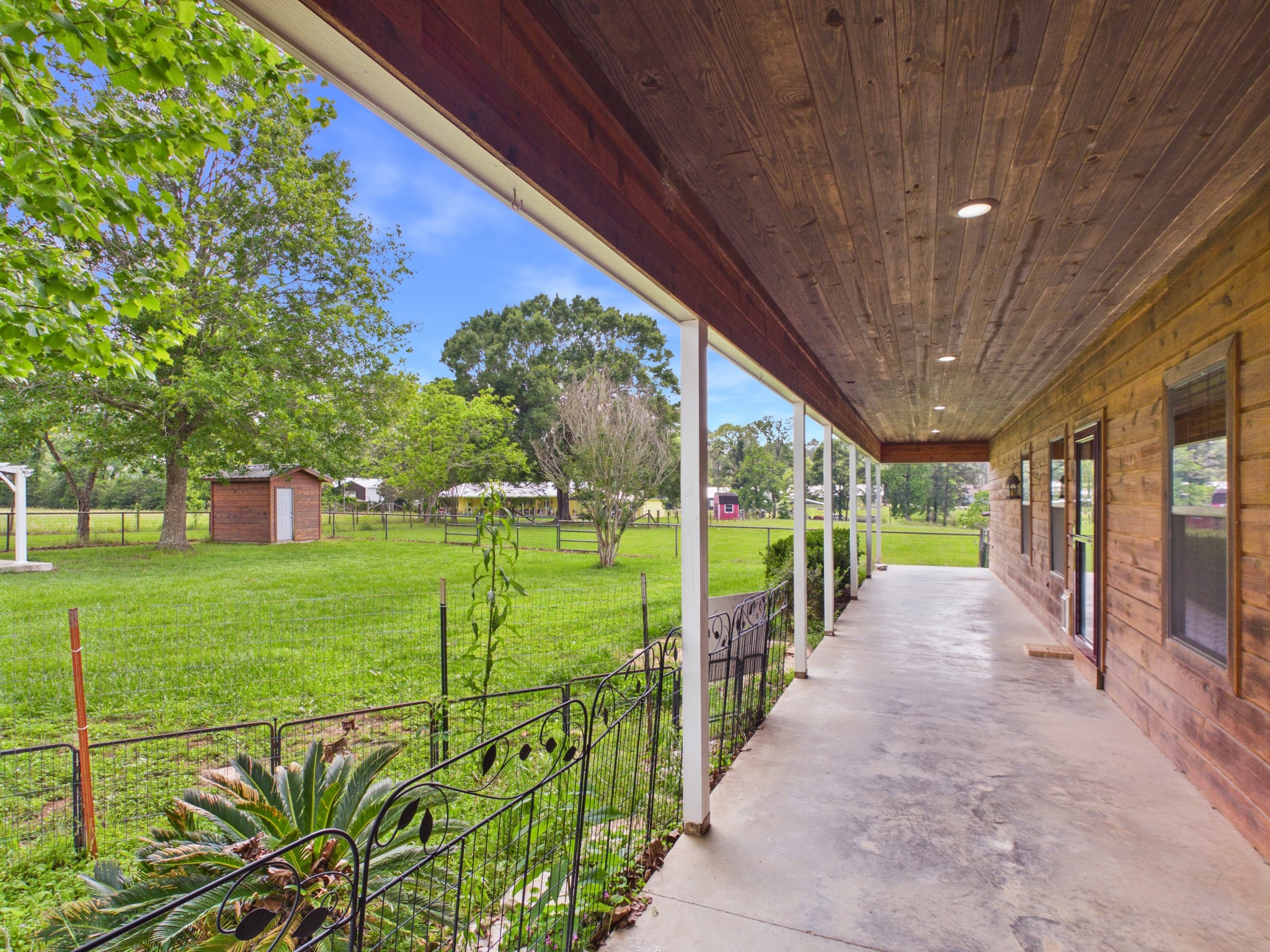 160 Vida Lane Coldspring, TX 77331 - Photo 19 of 23 Covered Front Porch and fenced front yard for the pets!