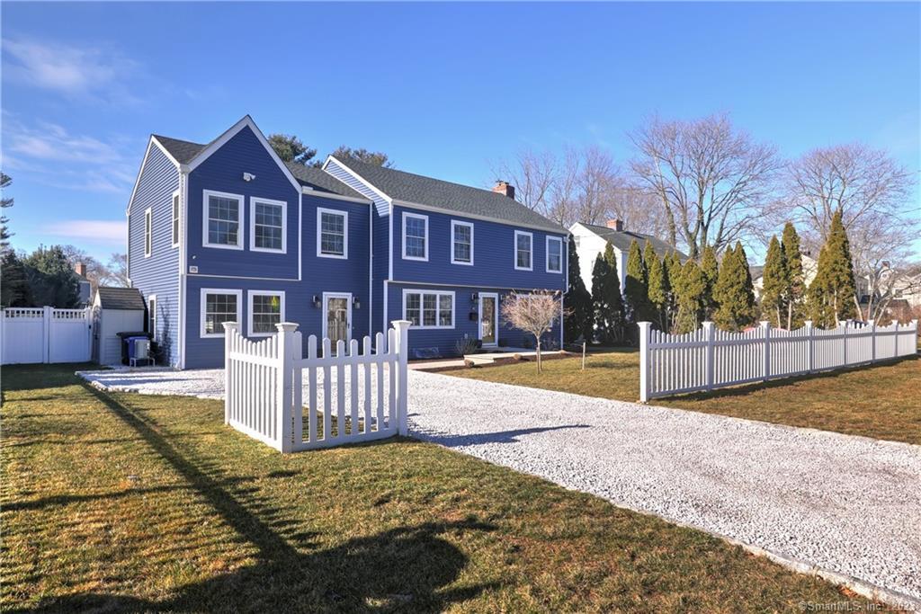 111 Sturges Road Fairfield, CT 06824 - Photo 1 of 1 a front view of a house with a yard