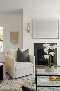 a living room with furniture and kitchen view