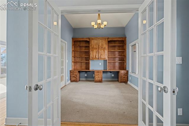 5510 Wilson Road Colorado Springs, CO 80919 - Photo 13 of 44 Office with built-in shelves and desk.