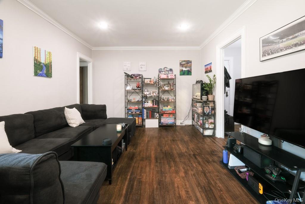 23 Old Mamaroneck Road, Unit 1M White Plains, NY 10605 - Photo 5 of 19 a living room with furniture and a flat screen tv