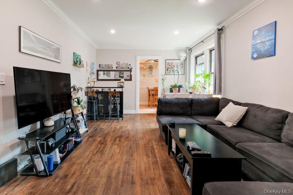 23 Old Mamaroneck Road, Unit 1M White Plains, NY 10605 - Photo 6 of 19 a living room with furniture and a flat screen tv