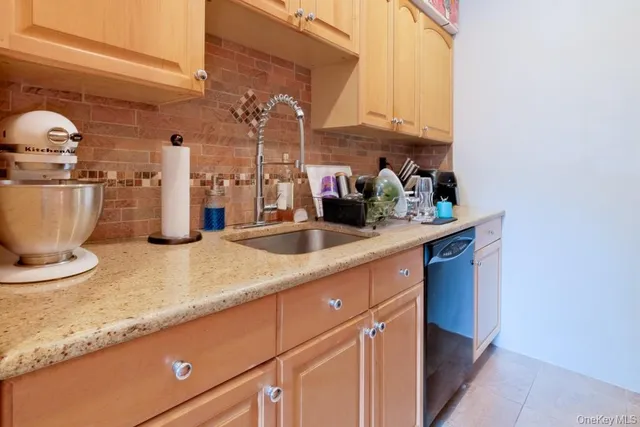 a kitchen with a sink and a stove