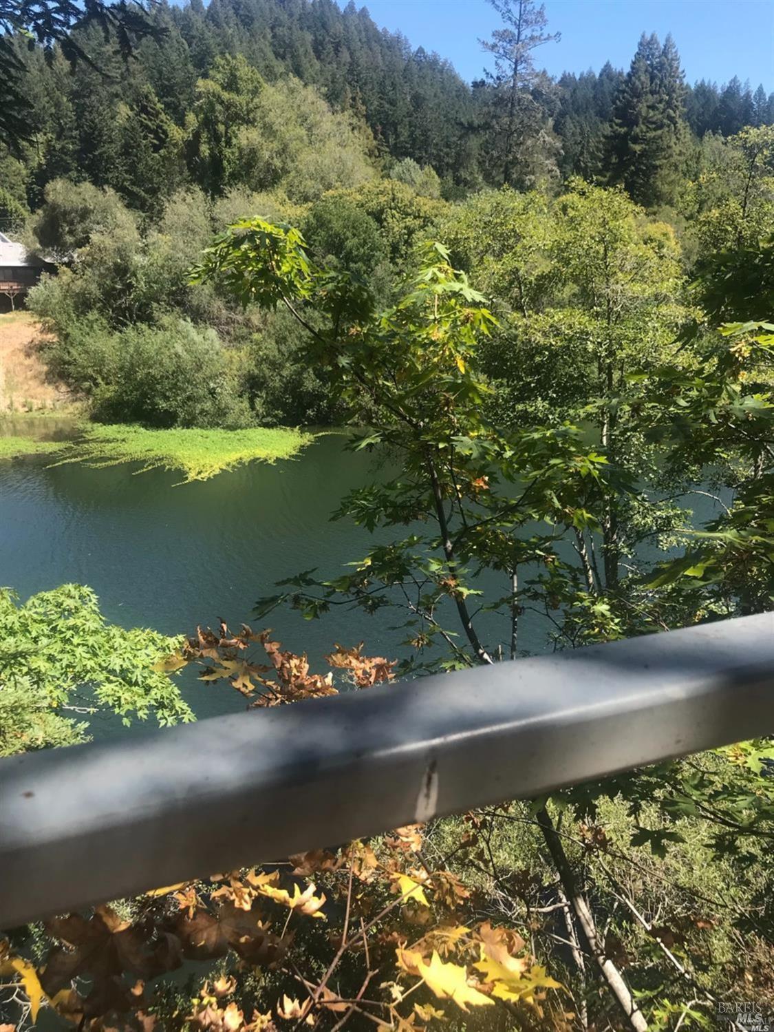17791 Old Monte Rio Road Guerneville, CA 95446 - Photo 2 of 3 a view of a lake with a mountain