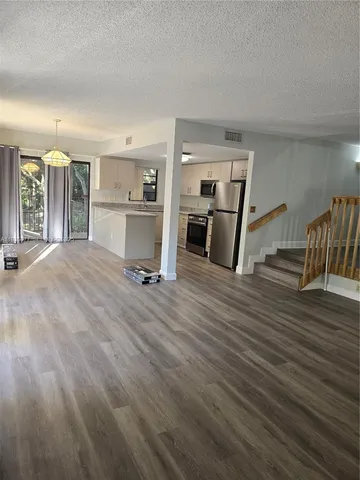 a view of livingroom with furniture and wooden floor