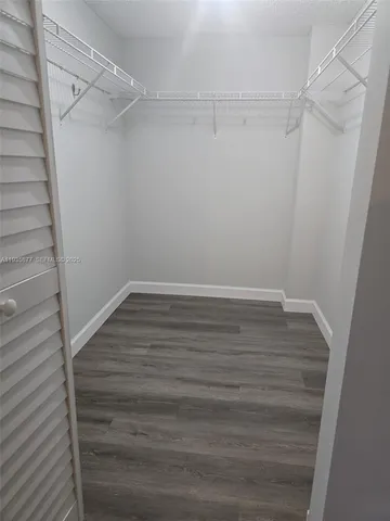 a view of an empty walk in closet