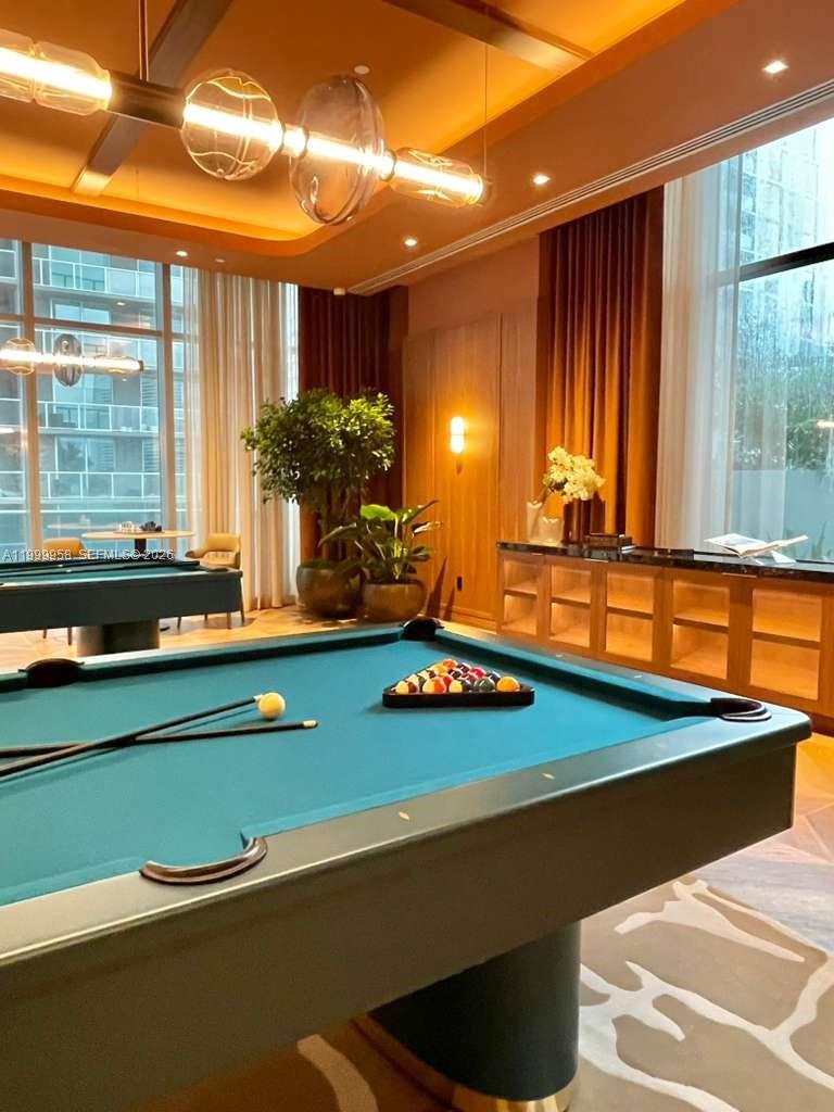 77 Southeast 5th Street, Unit 2905 Miami, FL 33131 - Photo 16 of 27 a room with pool table and windows