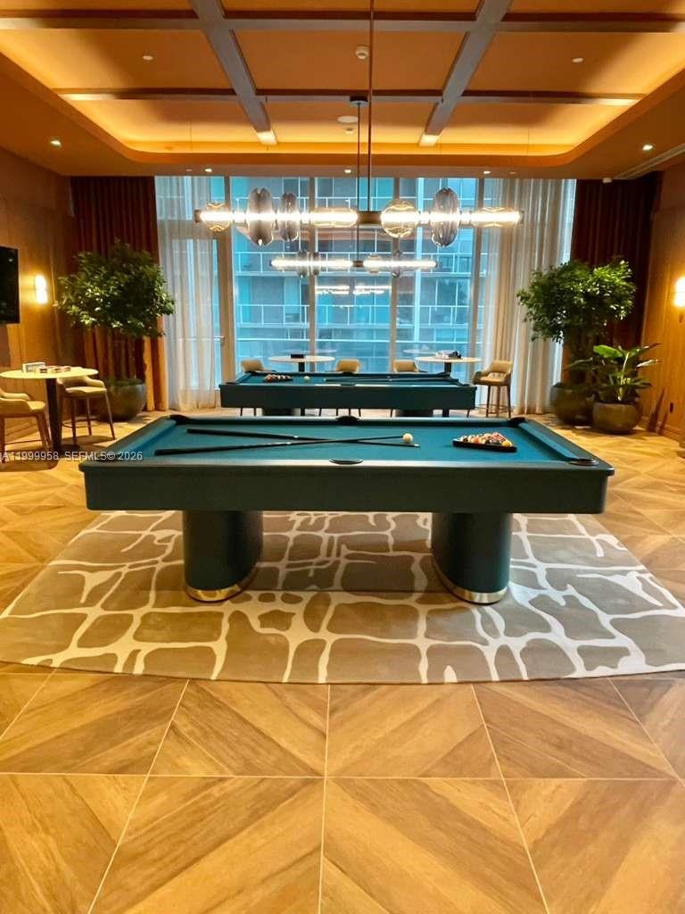 77 Southeast 5th Street, Unit 2905 Miami, FL 33131 - Photo 24 of 27 a view of swimming pool with outdoor seating