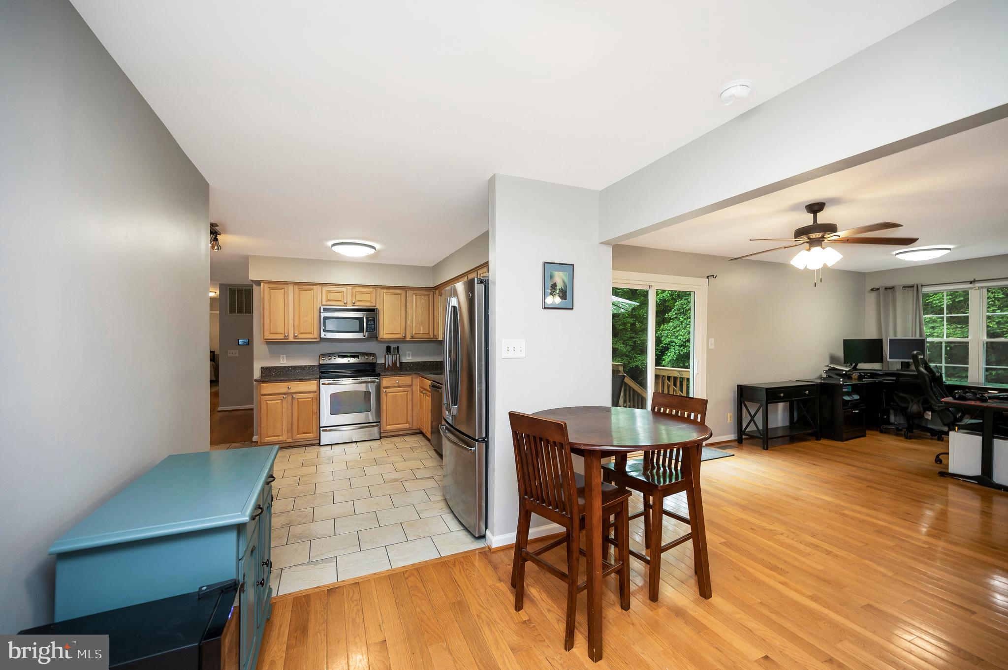 679 Cropp Road Fredericksburg, VA 22406 - Photo 20 of 39 a living room with furniture wooden floor and kitchen view