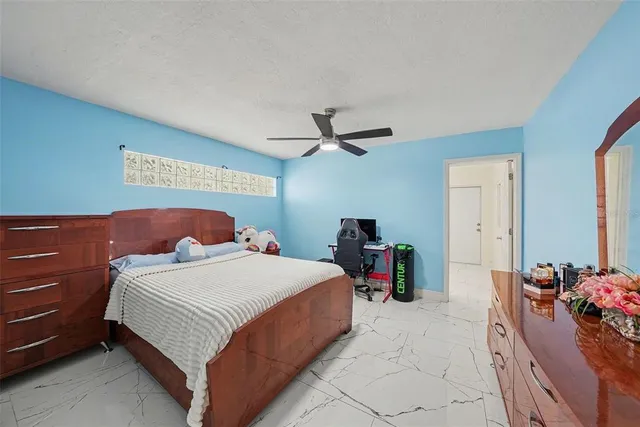 a bedroom with a bed and gym equipment