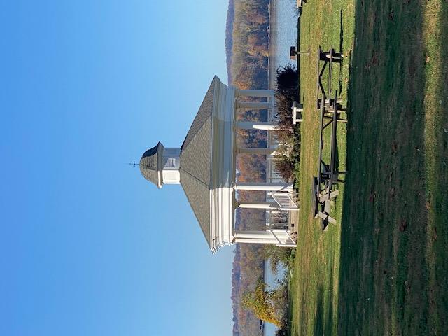 261 Shore Road Cornwall-on-Hudson, NY 12520 - Photo 9 of 11 a front view of a house with a yard