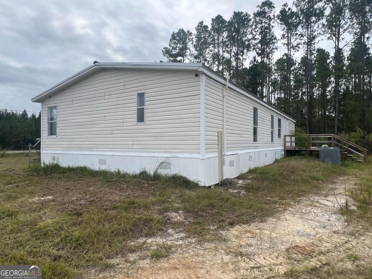300 Josephine Park Road Waycross, GA 31503 - Photo 17 of 19 a backyard of a house