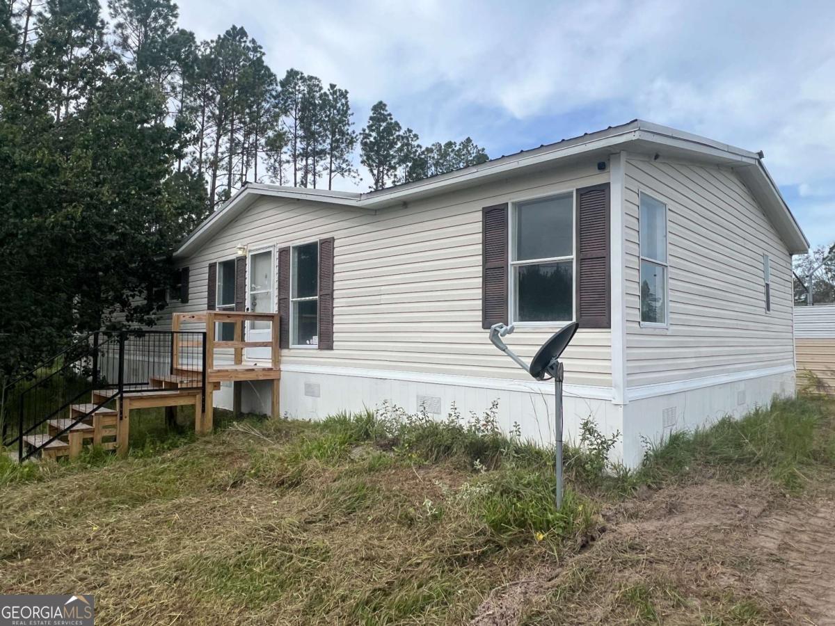 300 Josephine Park Road Waycross, GA 31503 - Photo 18 of 19 a front view of a house with garden
