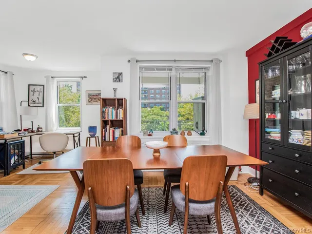 a view of a dining room with furniture window and outside view