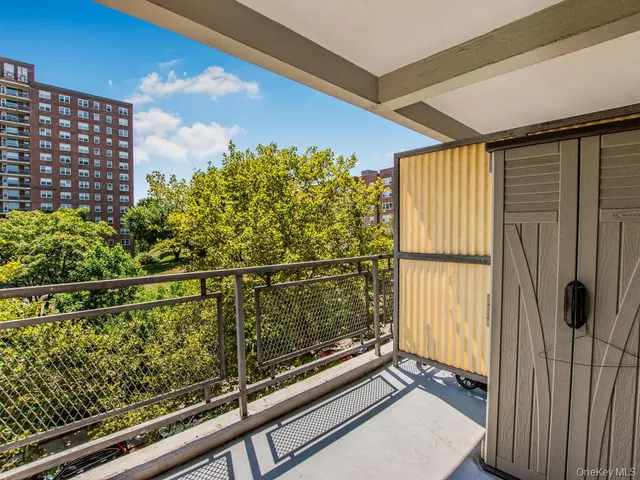 a view of balcony with wooden floor
