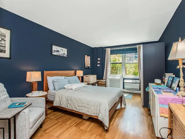 a bedroom with a bed and a table in it