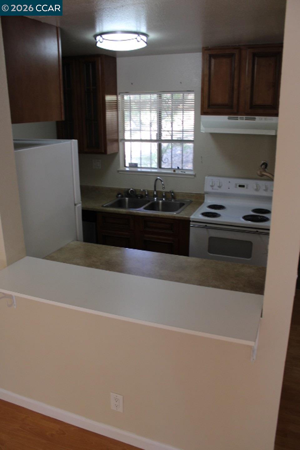 507 Chabre Court El Sobrante, CA 94803 - Photo 12 of 29 a kitchen with a stove and a refrigerator