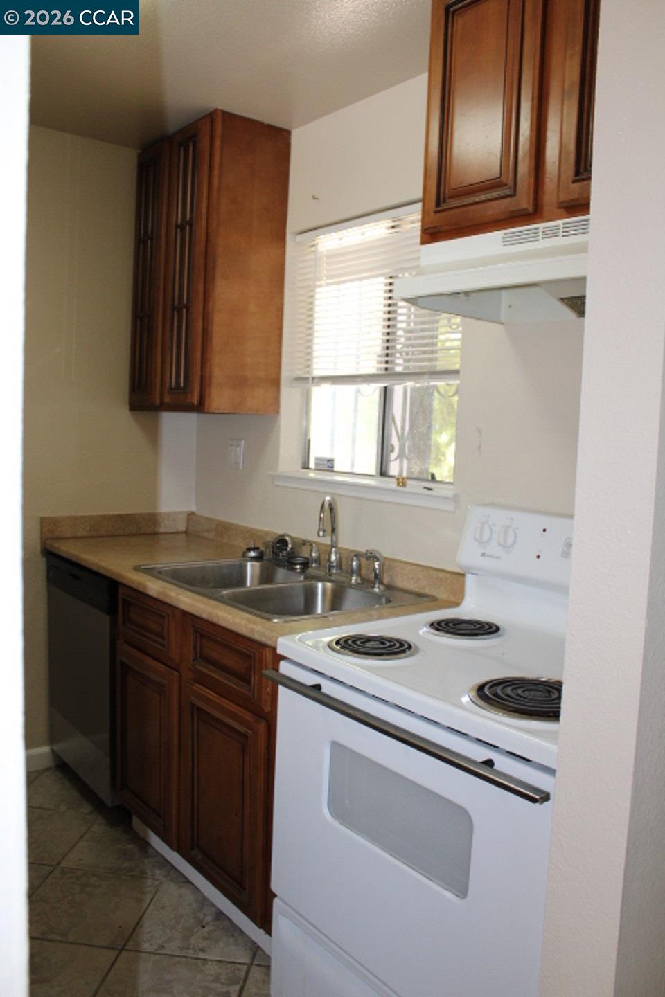 507 Chabre Court El Sobrante, CA 94803 - Photo 13 of 29 a kitchen with a stove and a sink
