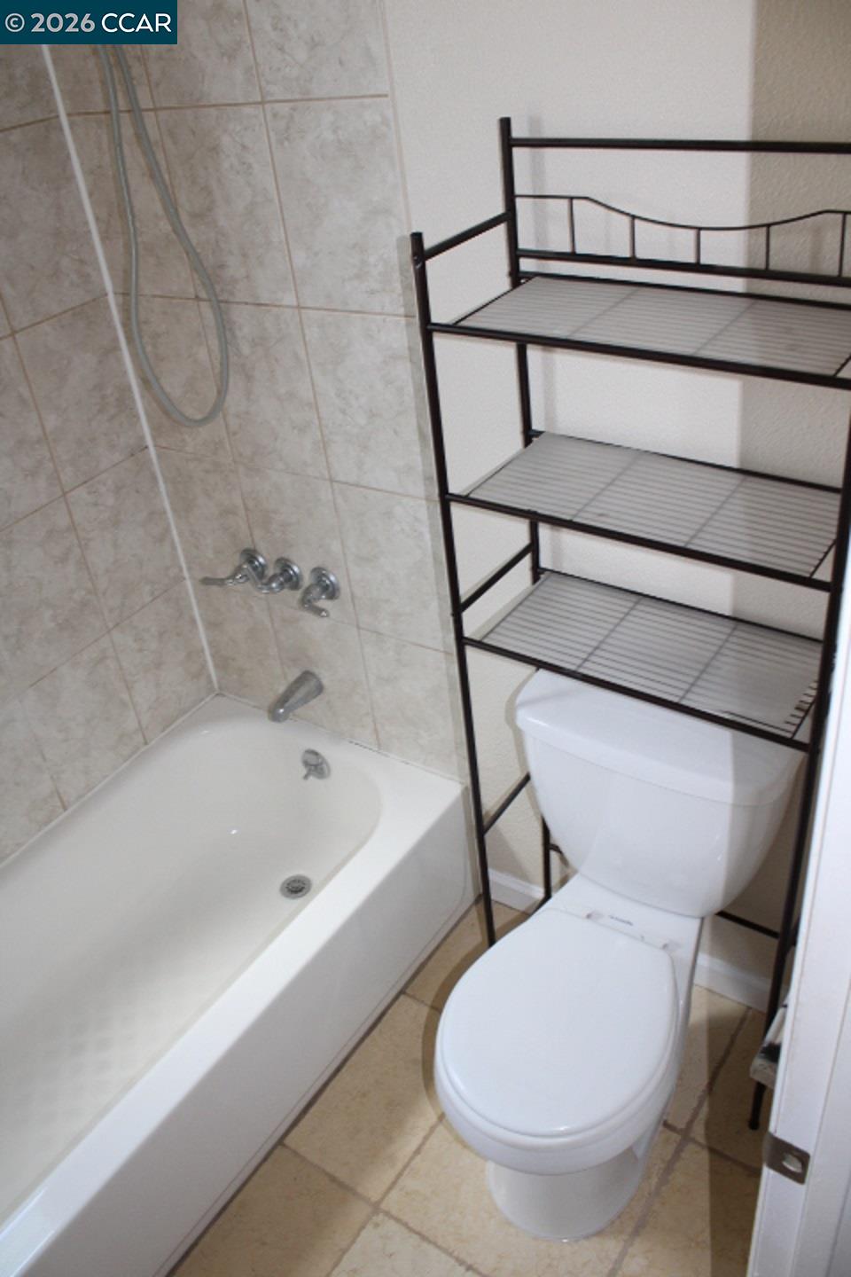 507 Chabre Court El Sobrante, CA 94803 - Photo 28 of 29 a bathroom with a toilet and a bathtub