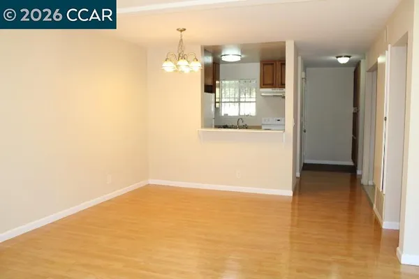 a kitchen with stainless steel appliances granite countertop a refrigerator and a cabinets