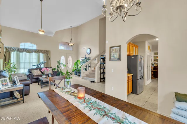a kitchen with a refrigerator and a stove