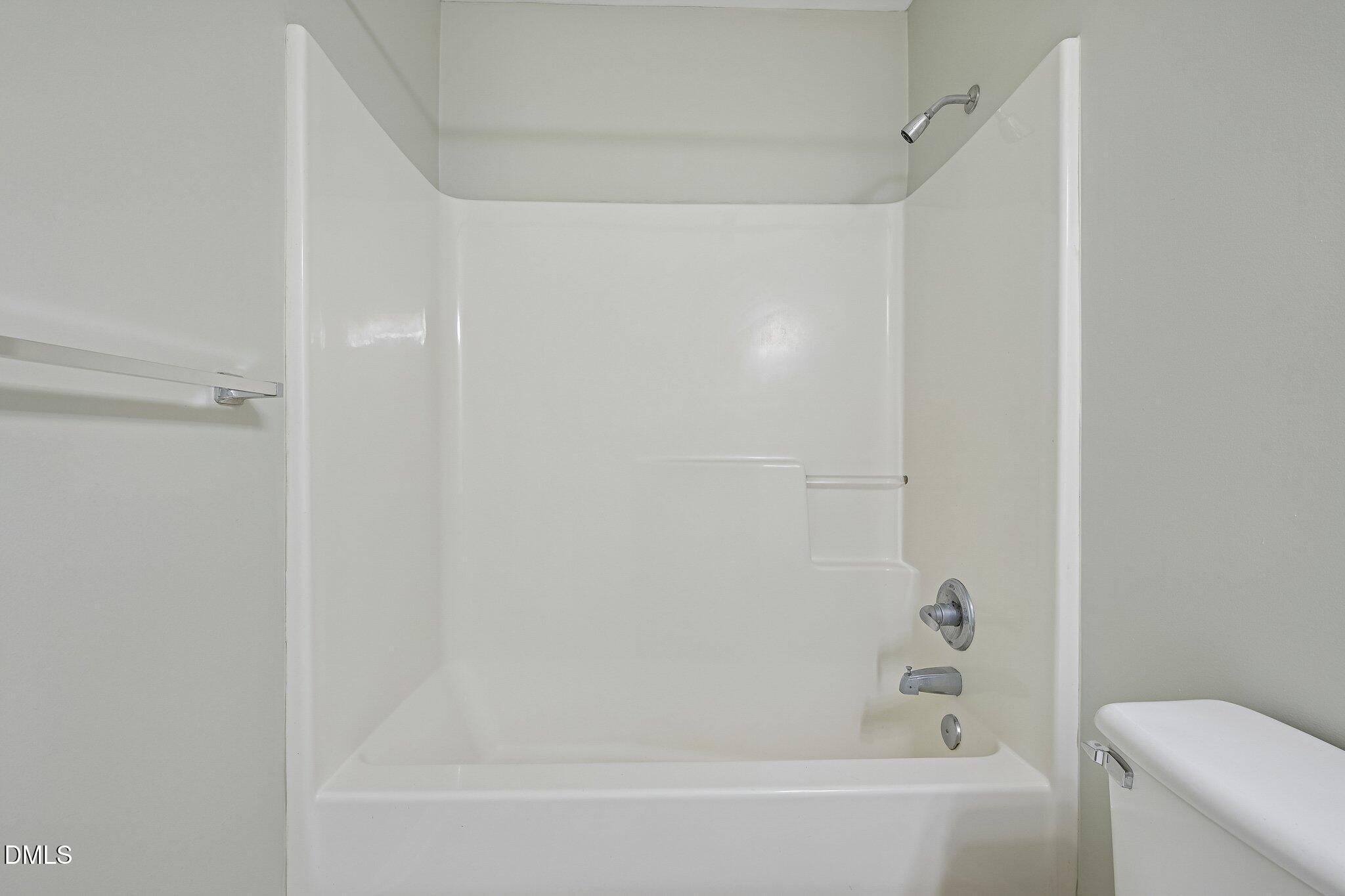 278 South Raleigh Street Angier, NC 27501 - Photo 26 of 35 a bathroom with a bathtub and a toilet