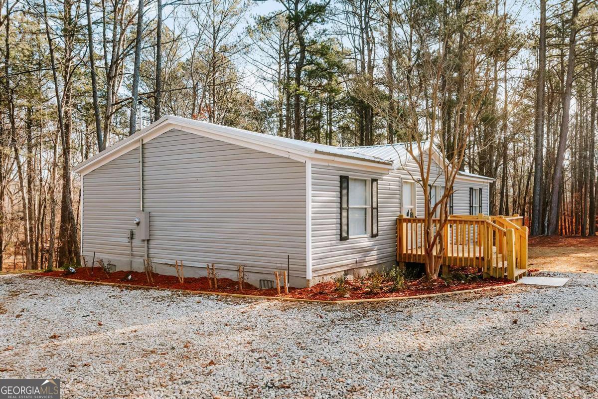 72 Frank Mathews Road Lexington, GA 30648 - Photo 2 of 36 a view of a house with a yard