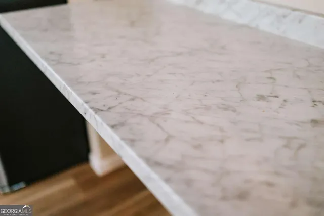 a view of wooden floor and a hallway