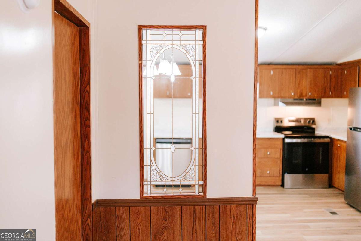 72 Frank Mathews Road Lexington, GA 30648 - Photo 24 of 36 a kitchen with a refrigerator and a stove top oven
