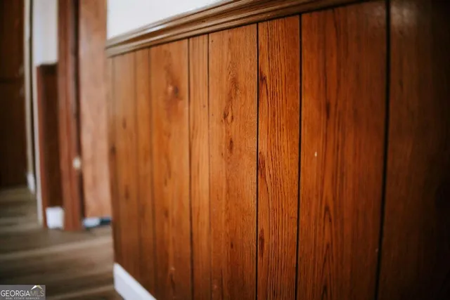 a view of a large window with wooden walls