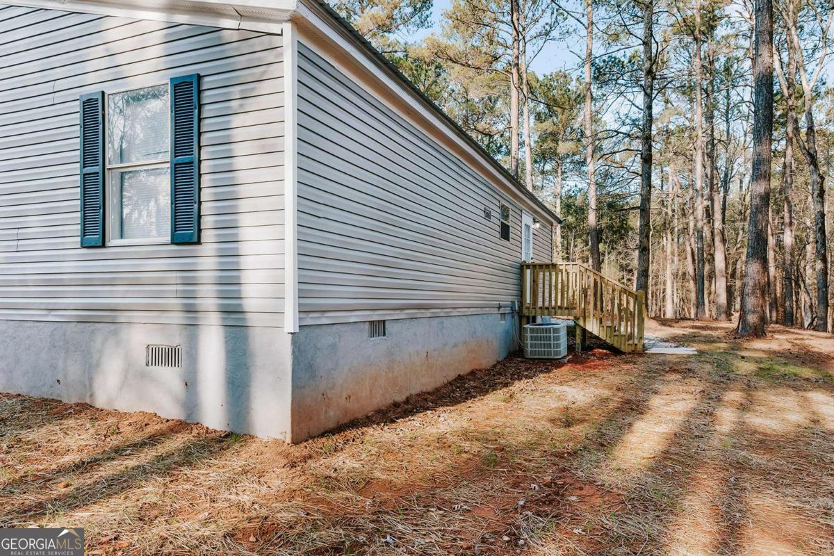 72 Frank Mathews Road Lexington, GA 30648 - Photo 6 of 36 a view of a house with a yard