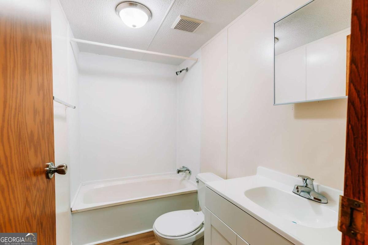 72 Frank Mathews Road Lexington, GA 30648 - Photo 8 of 36 a bathroom with a sink toilet and shower