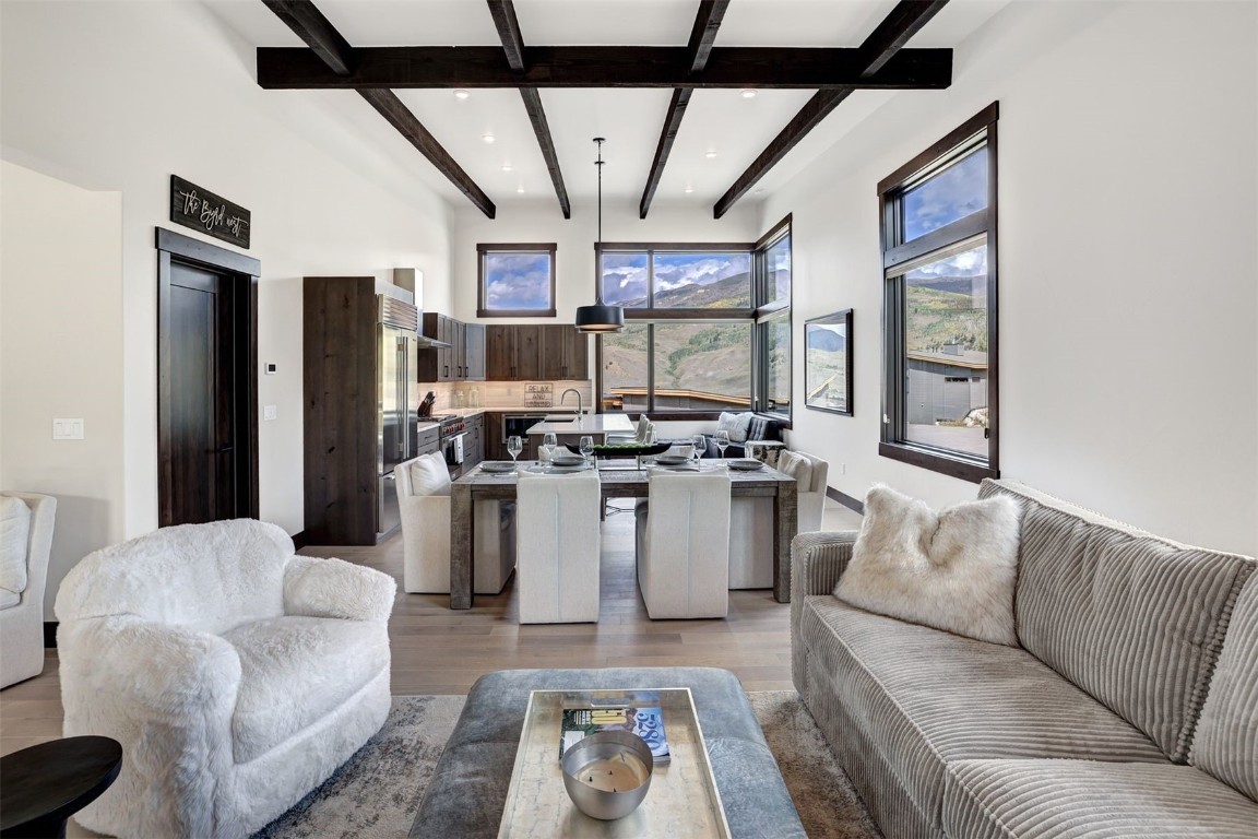 160 Vendette Road Silverthorne, CO 80498 - Photo 15 of 50 Living room with beam ceiling and light wood-style floors
