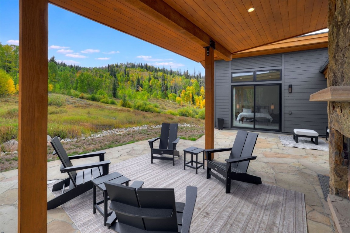 160 Vendette Road Silverthorne, CO 80498 - Photo 2 of 50 Deck with a patio area and a forest view