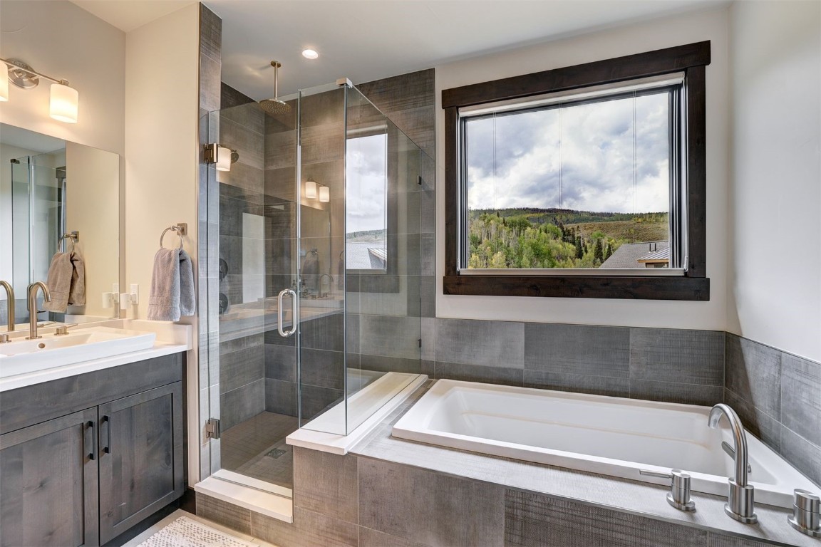160 Vendette Road Silverthorne, CO 80498 - Photo 27 of 50 Bathroom with vanity, a shower stall, a garden tub, and recessed lighting