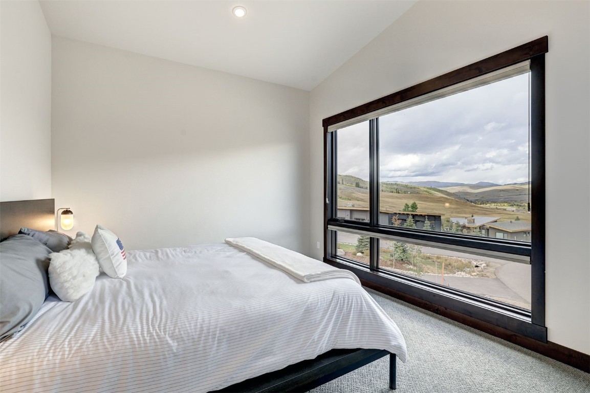 160 Vendette Road Silverthorne, CO 80498 - Photo 29 of 50 Carpeted bedroom with vaulted ceiling, a mountain view, and recessed lighting