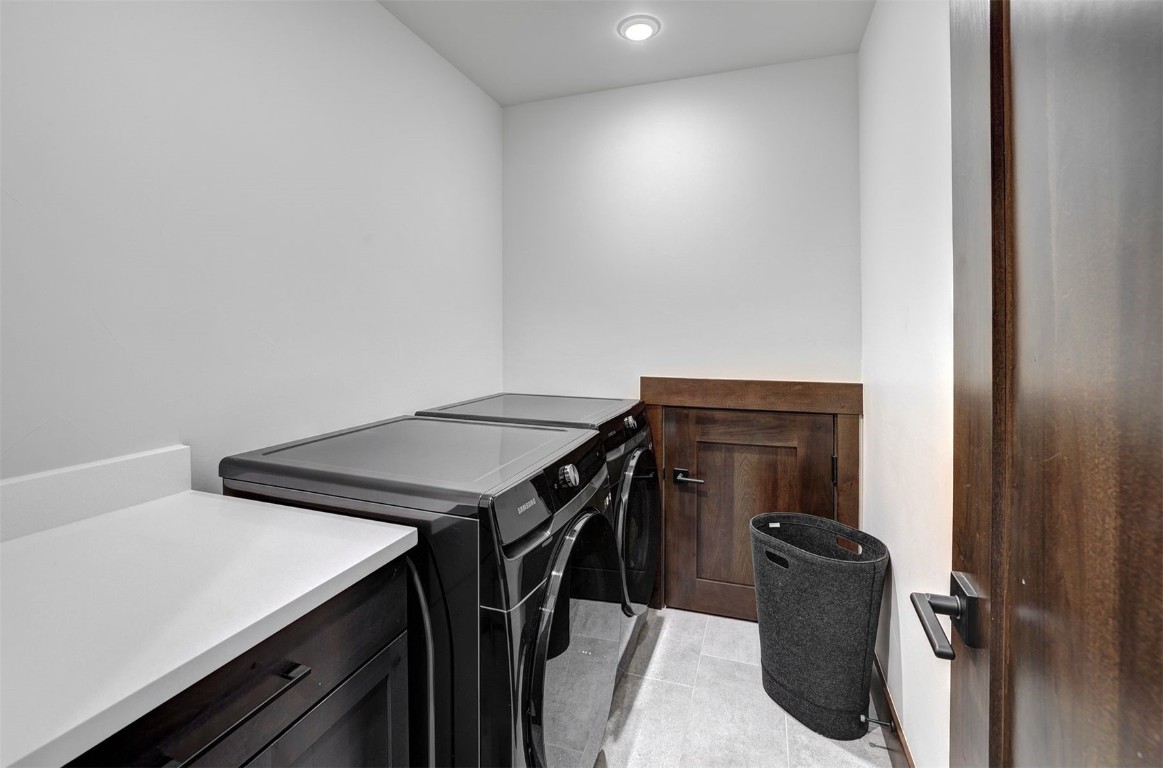 160 Vendette Road Silverthorne, CO 80498 - Photo 37 of 50 Washroom with light tile patterned floors and independent washer and dryer