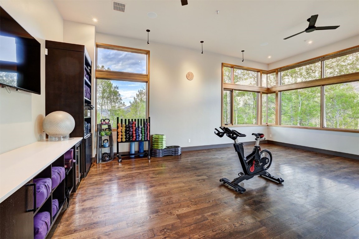 160 Vendette Road Silverthorne, CO 80498 - Photo 43 of 50 Workout area with dark wood-style flooring, ceiling fan, recessed lighting, and beverage cooler