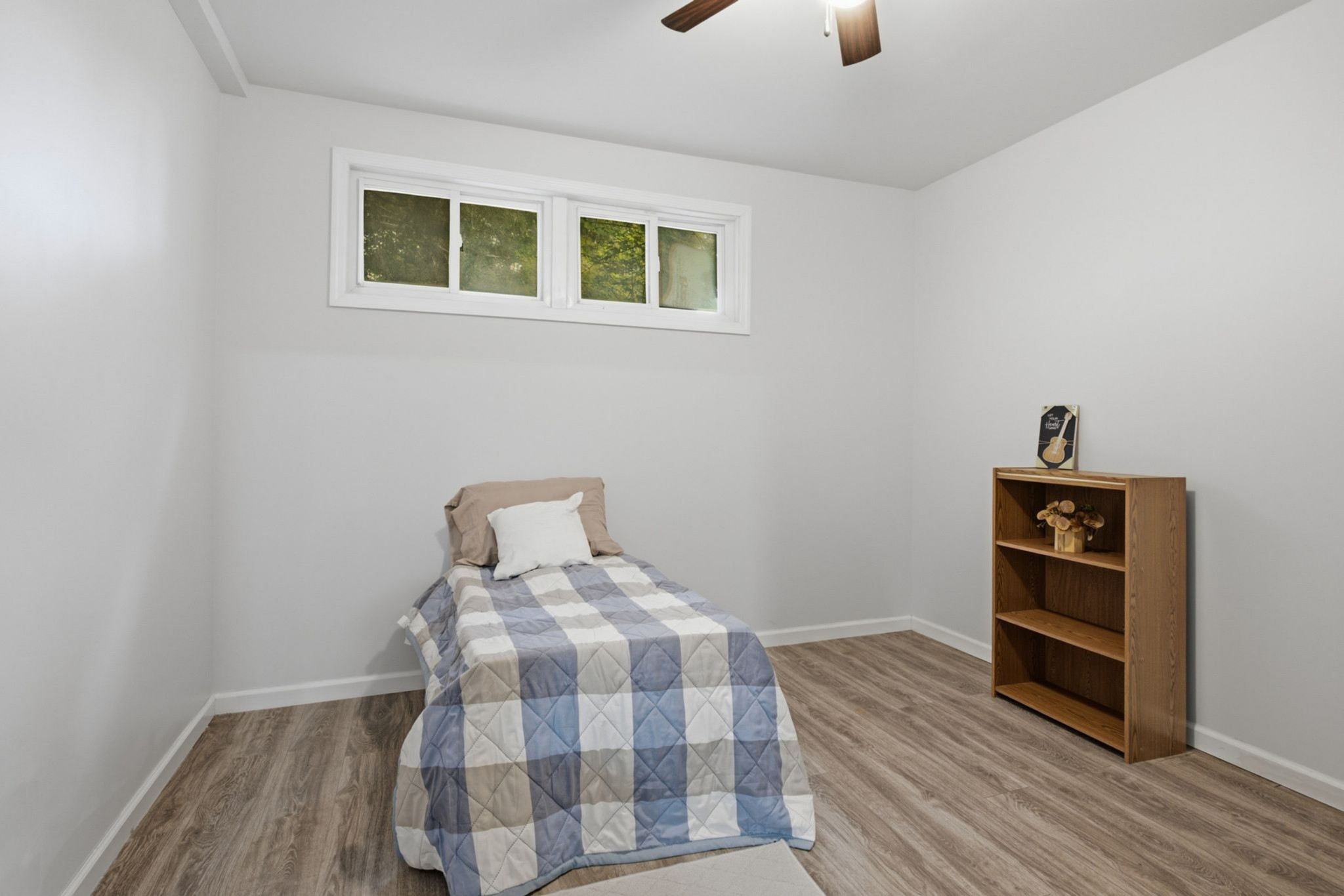 145 Crenshaw Road Bethpage, TN 37022 - Photo 26 of 34 a bedroom with a bed and a wooden floor