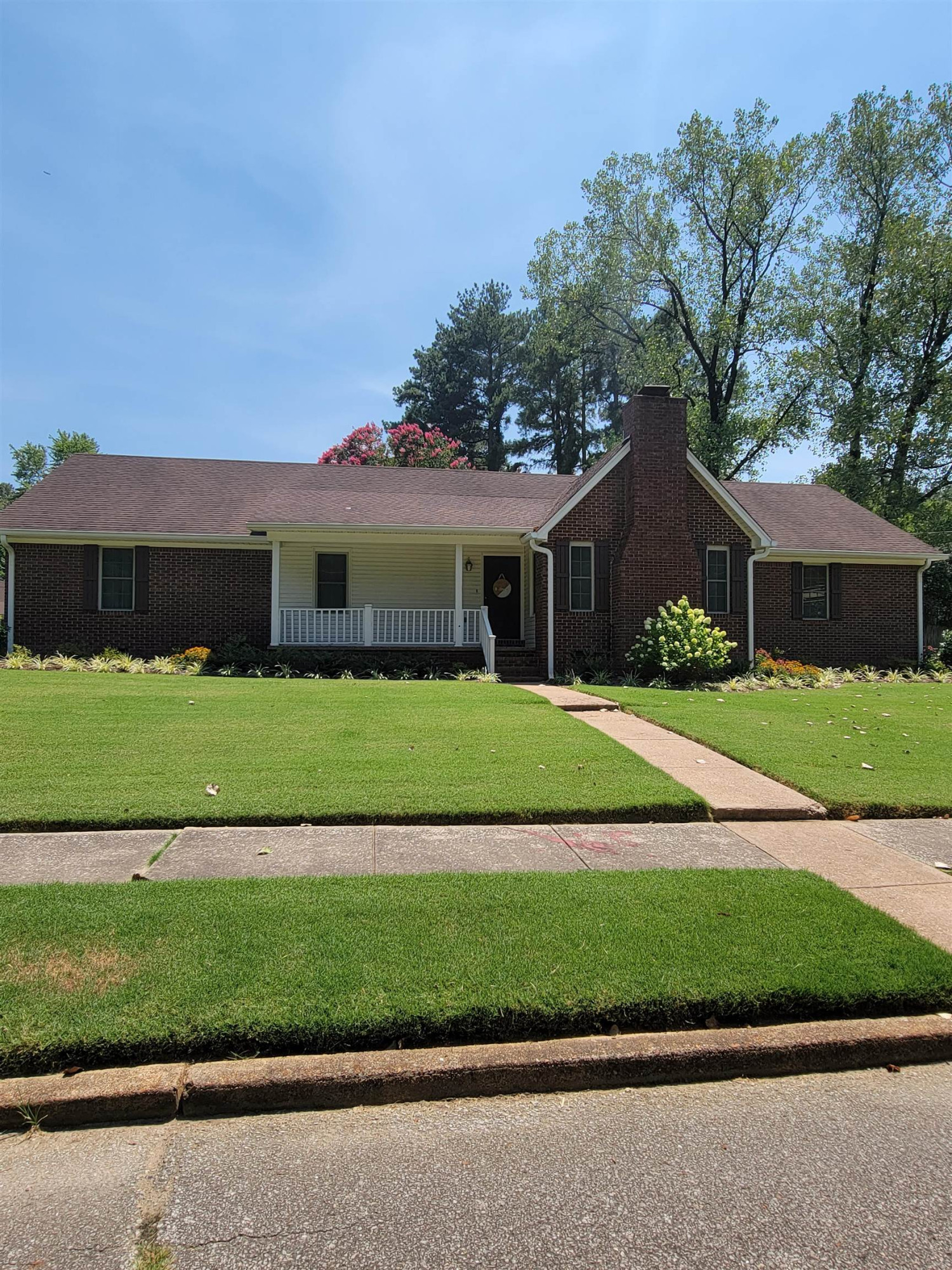 48 Windy Hill Road Jackson, TN 38305 - Photo 1 of 20 a front view of a house with a garden and